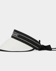 White visor with black strap on a light gray background