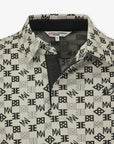 Patterned beige shirt with a brand label on a white background