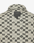 Patterned beige shirt with brand logo and text on a white background