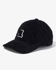 Black quilted cap with a logo on a white background