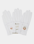 White golf gloves with perforated design and Golden Bear logo patch