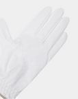 White gloves with a textured finish on a light gray background
