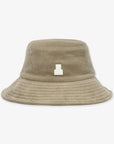 Beige bucket hat with a small logo on a white background