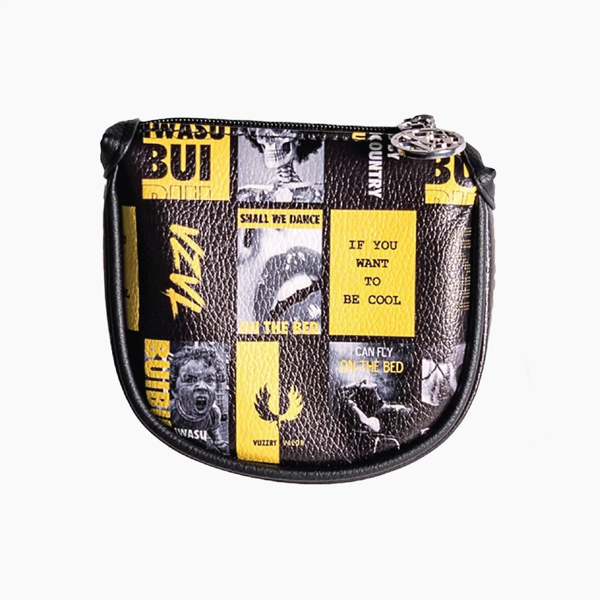 A small zippered head cover with a black textured faux-leather finish and a collage print of black-and-white images and yellow text blocks, plus a silver metal zipper pull.