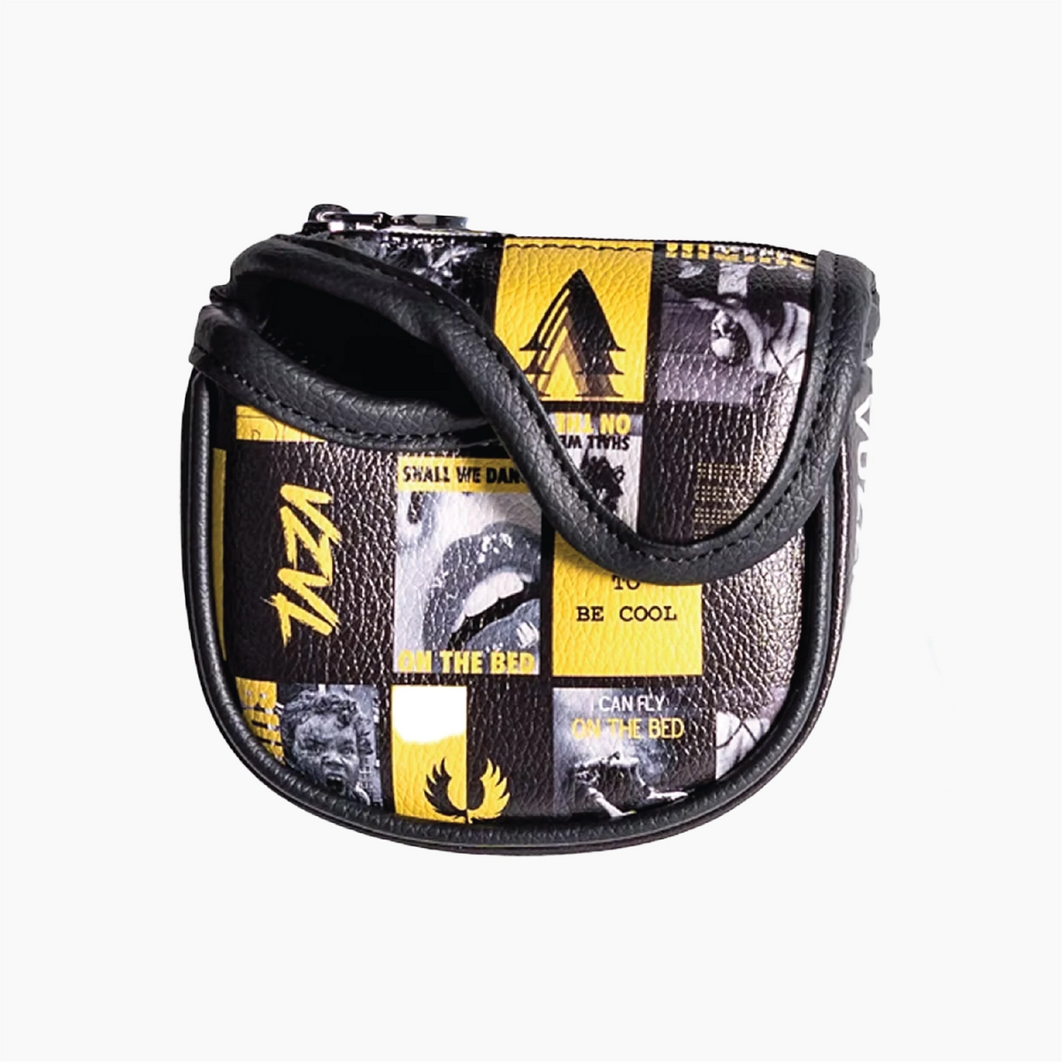 A small zippered head cover with a black and yellow patchwork collage print, featuring a black faux-leather strap and black trim, shown against a plain white background.
