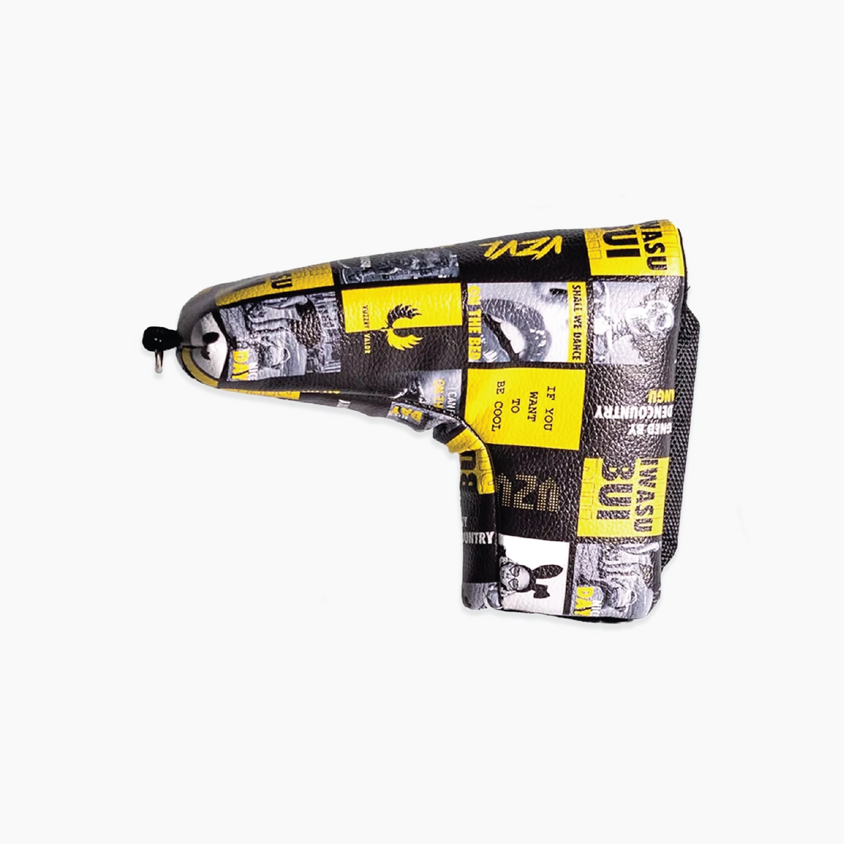 A golf club headcover with a bold yellow and black graphic collage print, shown on a plain light gray background.