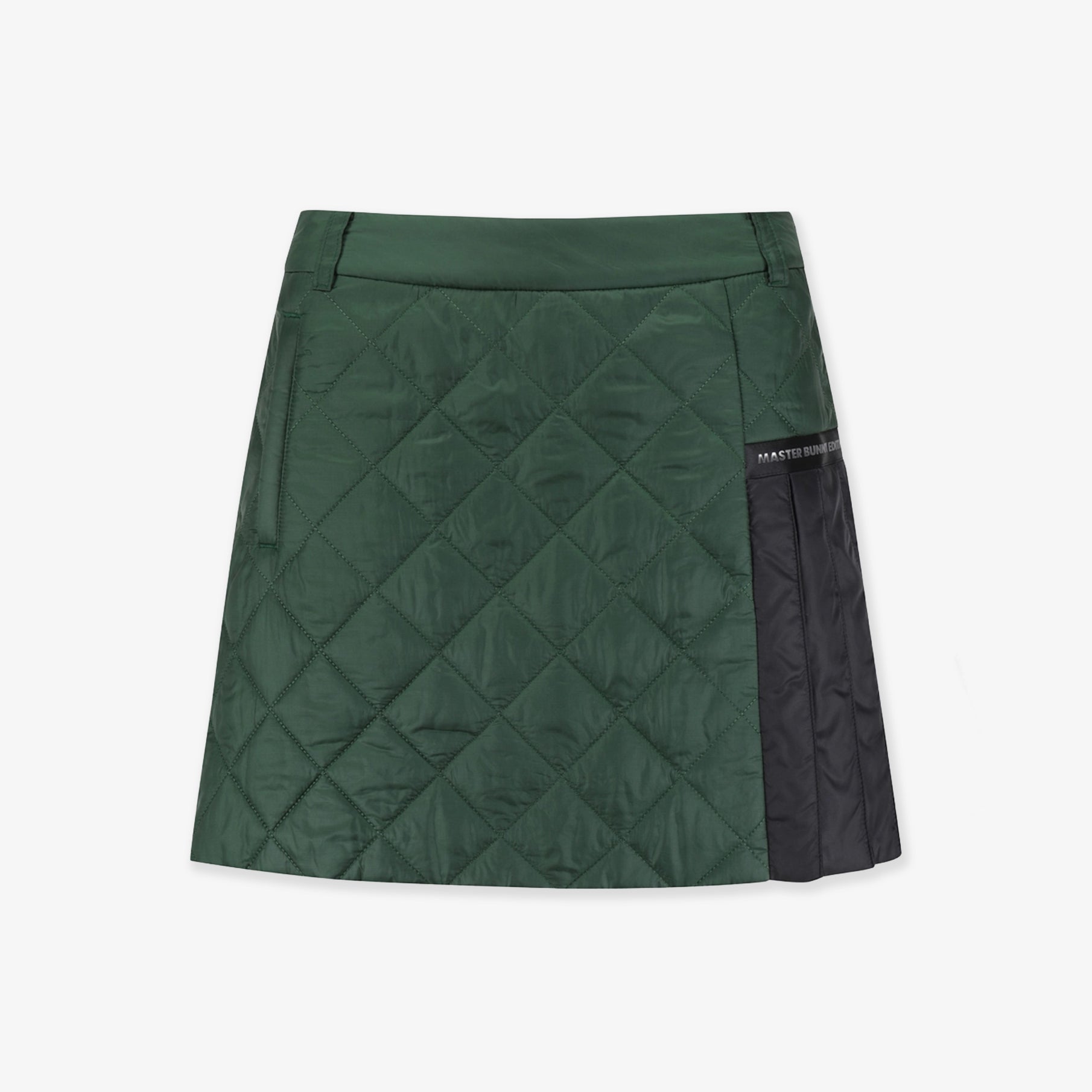 Green quilted skirt with black patch on a white background
