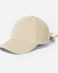Beige baseball cap with a bow on a white background