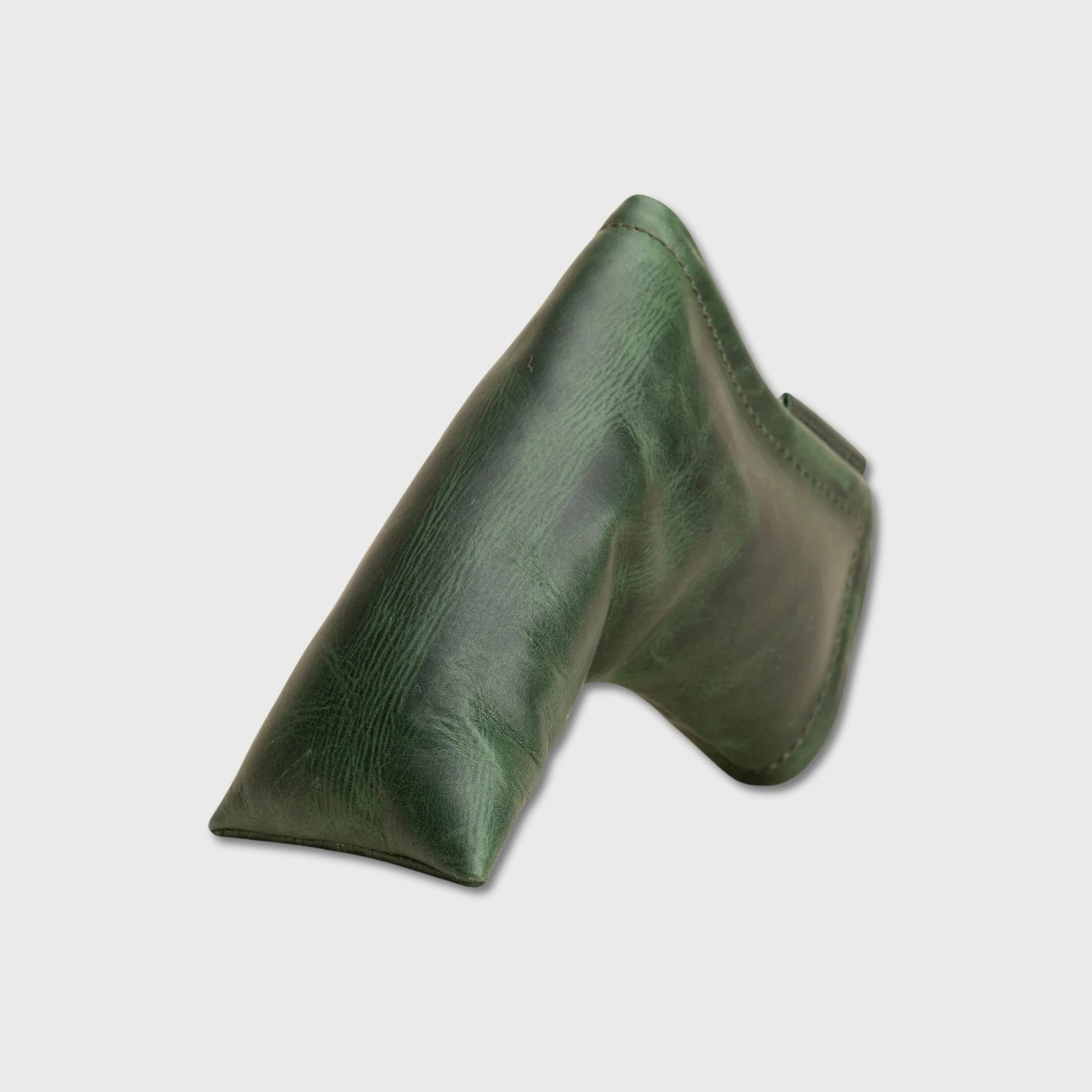 An olive green leather golf club headcover, shown from a three-quarters perspective on a light gray background.