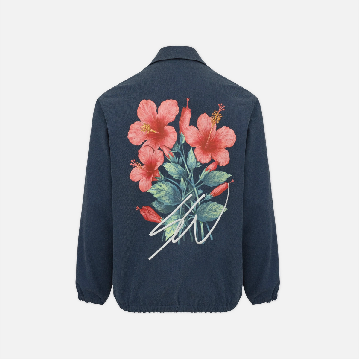 A navy blue jacket shown from the back, featuring a large graphic print of pink hibiscus flowers and green leaves on the upper back, with a white signature-style graphic overlay.