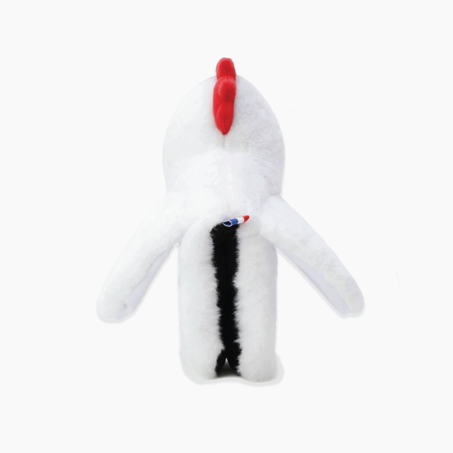 A white plush toy shaped like a stylized bird or duck with a bright red comb on top, a black vertical stripe down the center, and small red, white, and blue details near the chest, photographed on a plain white background.