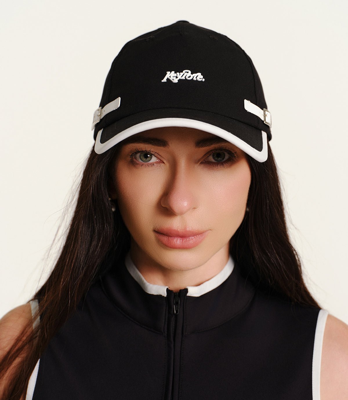 Keypote Black Clip Golf Cap Front Face View on Model | Erthe Golf