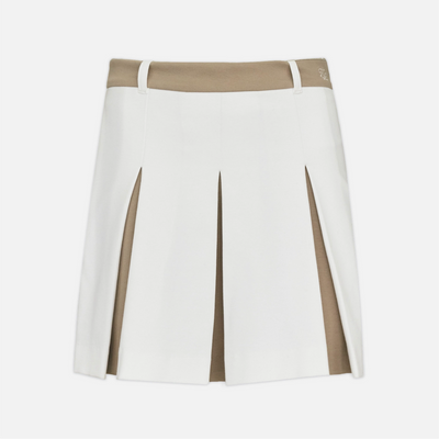 A white pleated tennis skirt with tan contrast panels at the waistband and side seams, shown flat against a light gray background.