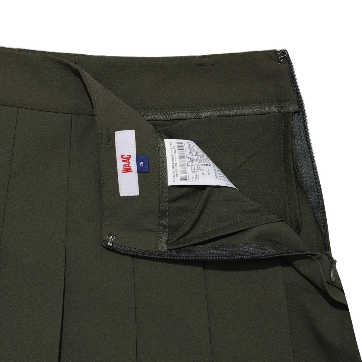 Close-up of khaki golf skort interior with zippered pocket