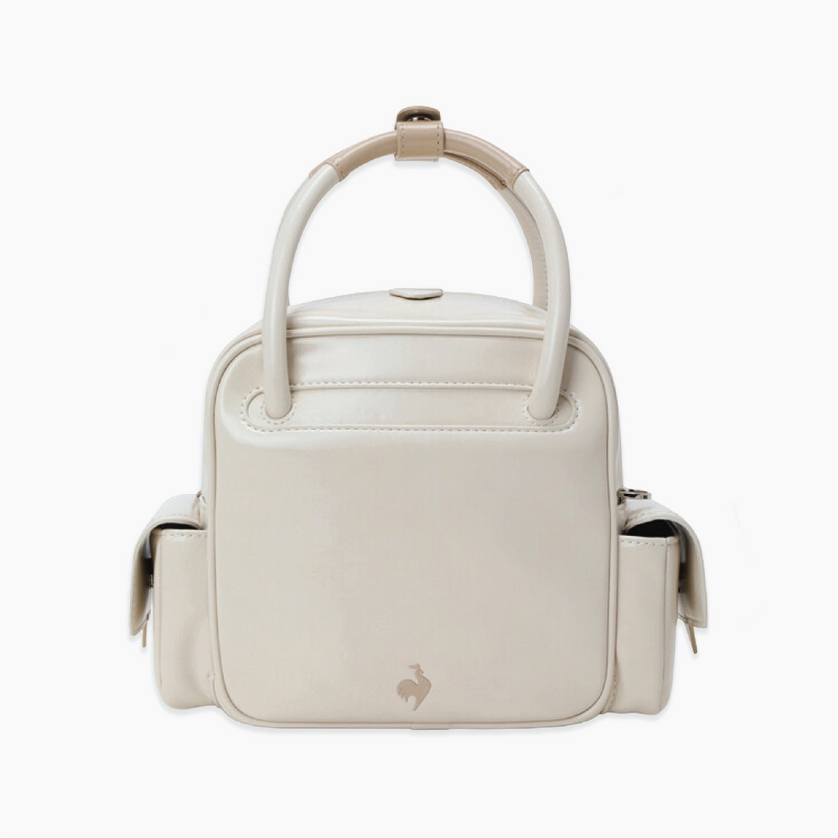 A structured cream-colored leather handbag with a top handle and a small rooster logo on the front, set against a plain white background.