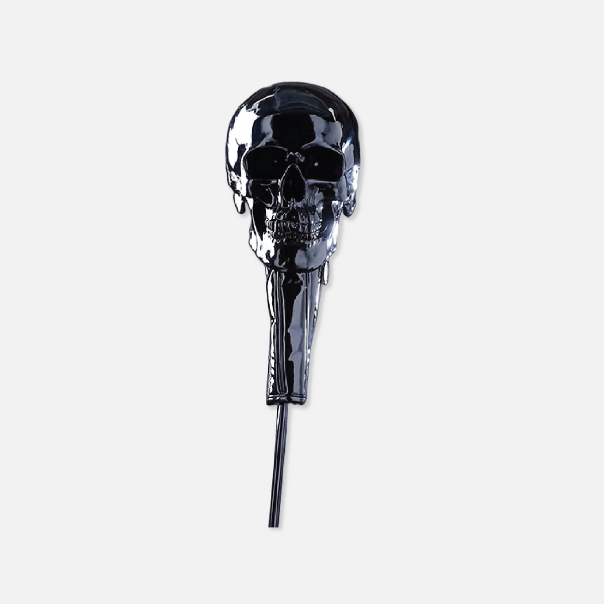 A glossy black skull-shaped gold head cover with a long cord extending downward, photographed against a plain light gray background.