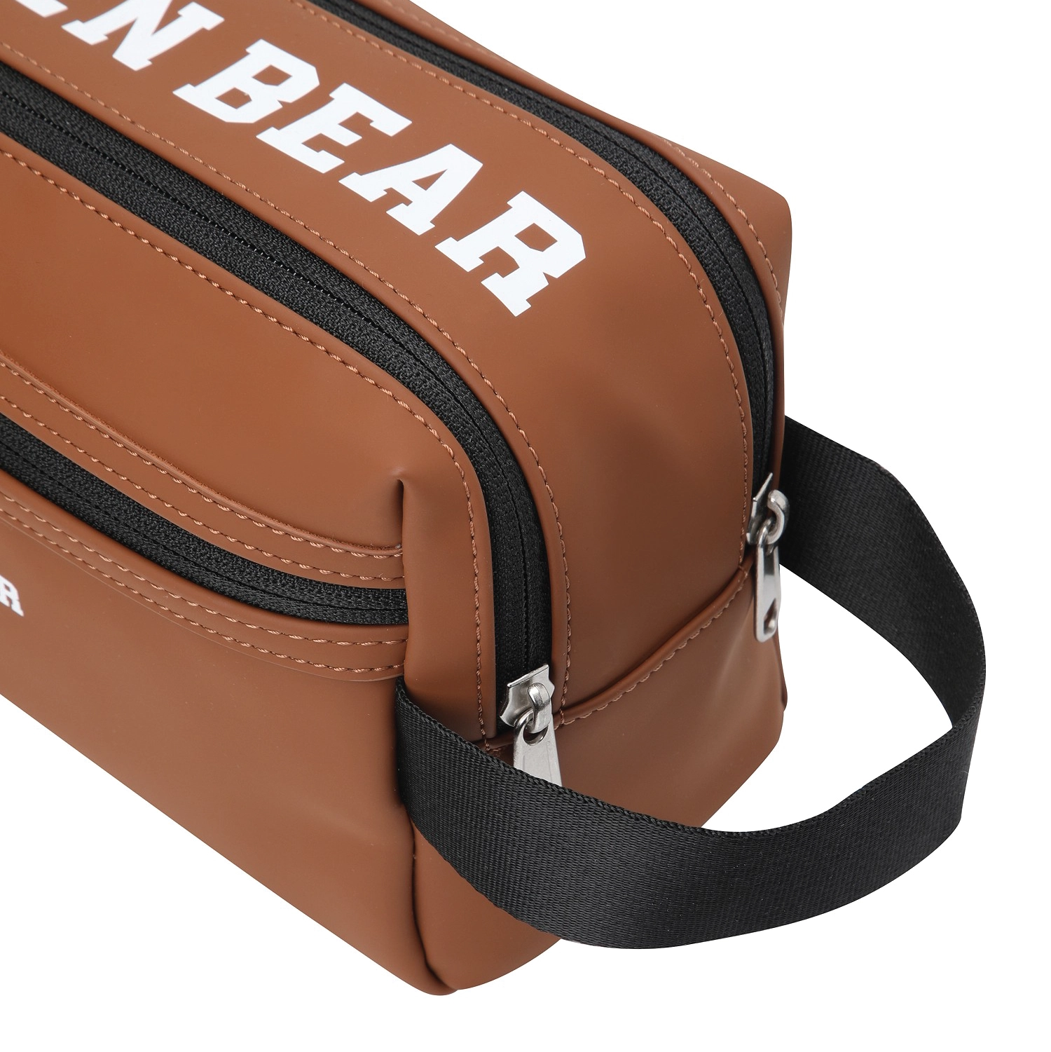 A brown faux-leather crossbody bag with a black strap and black zippers, featuring the text 'GOLDEN BEAR' in white on the front.