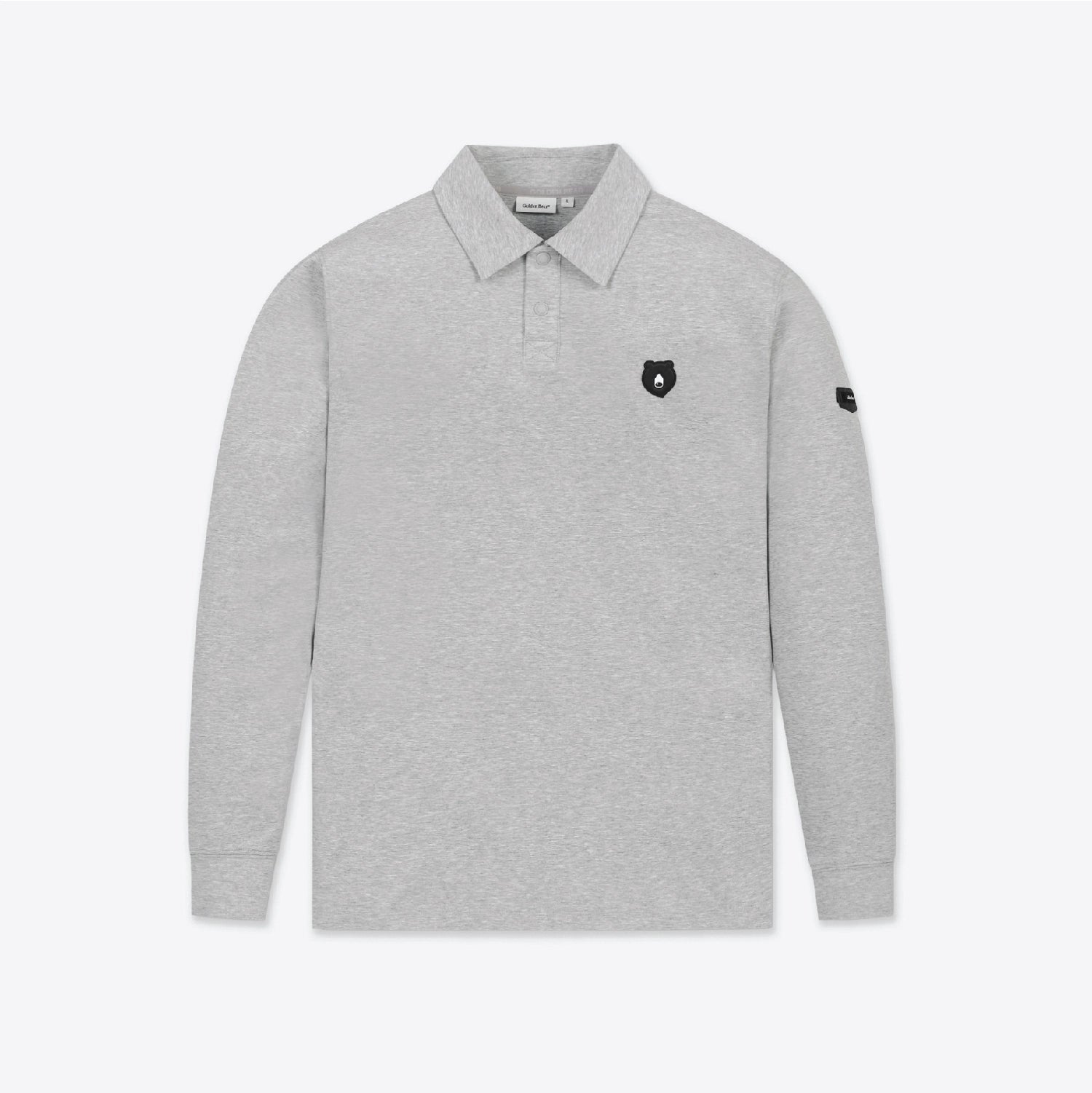 A light gray long-sleeve polo shirt with a small black shield logo on the left chest and a black logo patch on the right sleeve, shown against a plain light gray background.