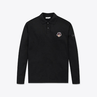 A black long-sleeve polo shirt with a small embroidered shield logo on the left chest and a small sleeve patch, displayed flat against a light gray background.