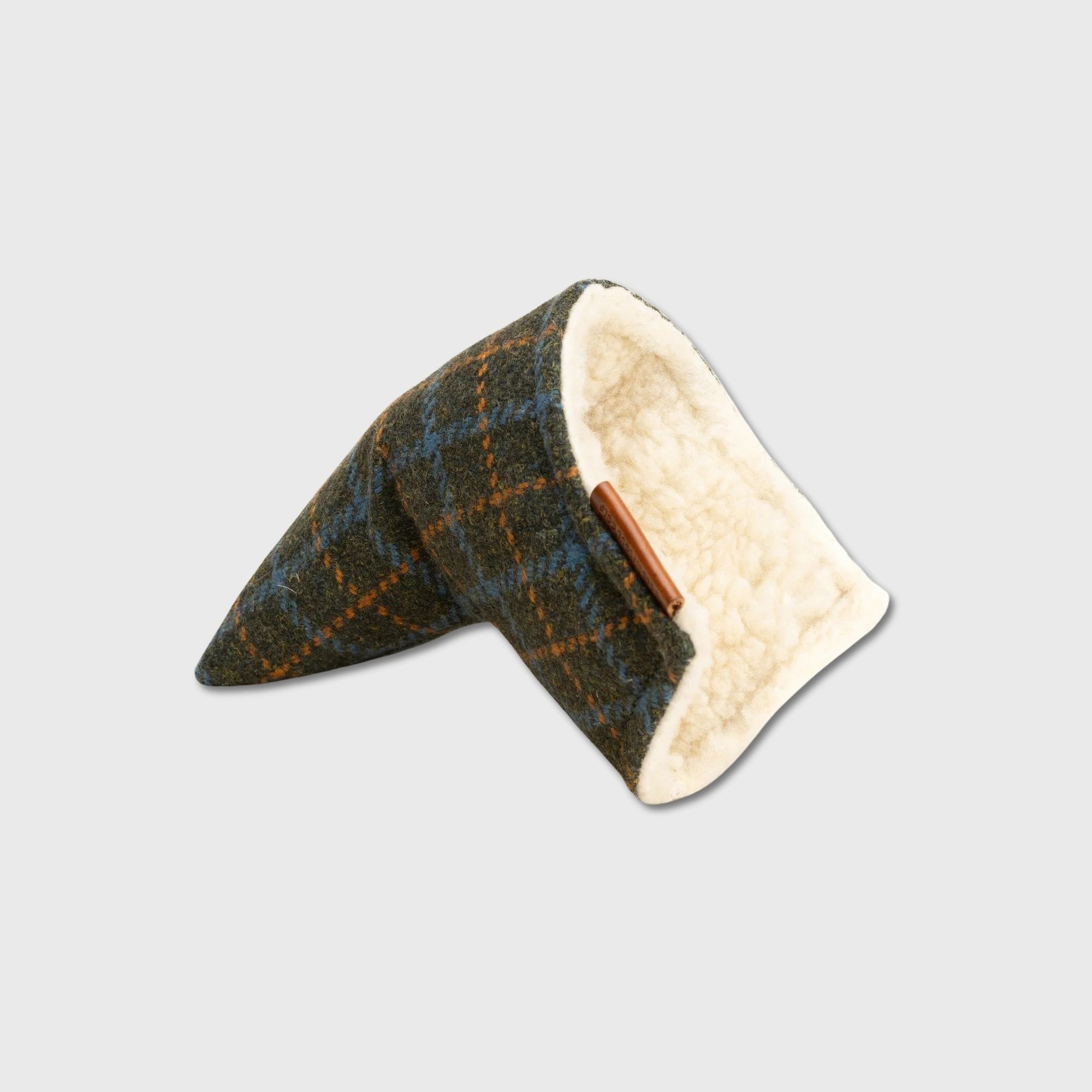 A putter cover with a dark green and brown plaid pattern, featuring a soft cream fleece lining and a small brown leather tab.