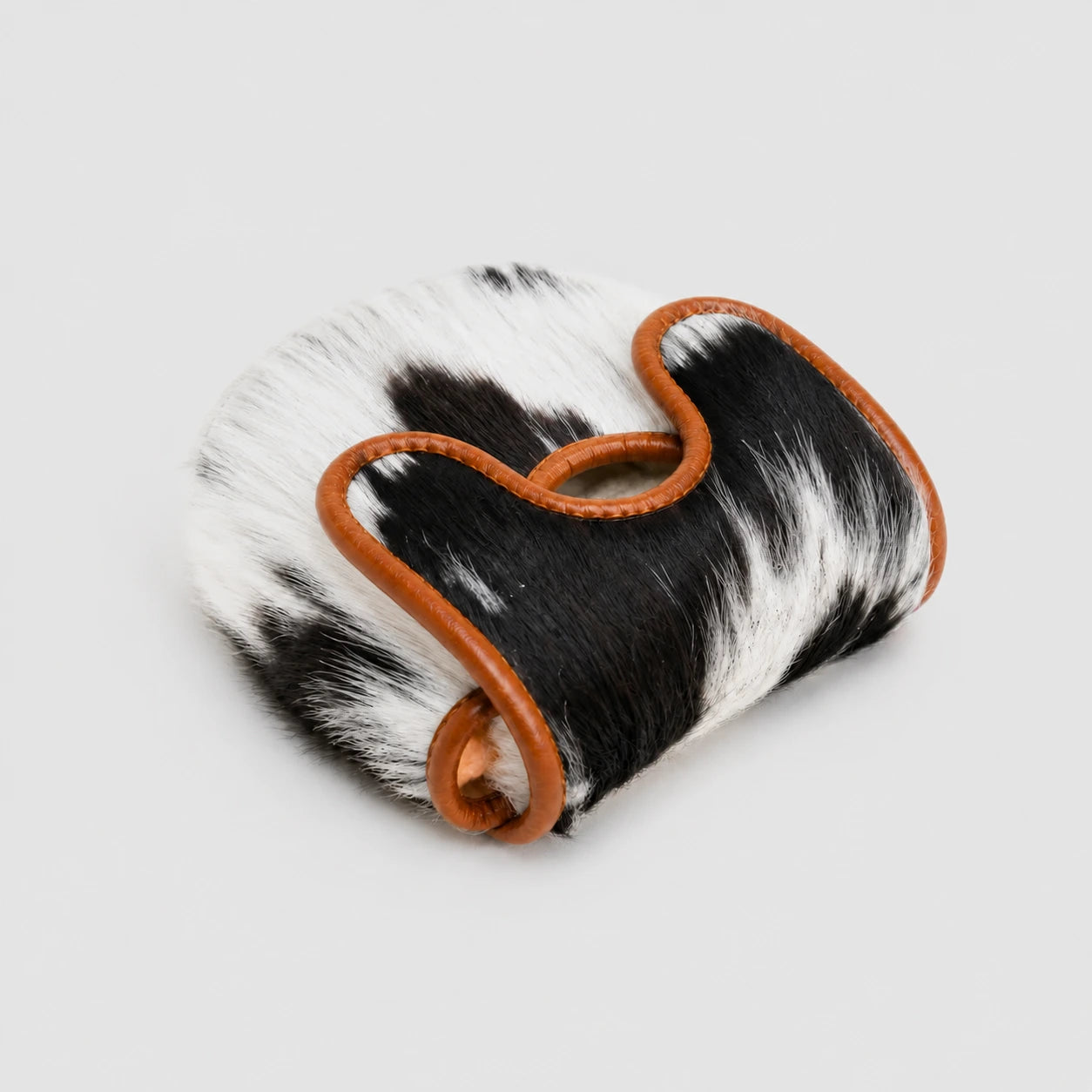 A Center DF3 Putter Cover with black and white cowhide pouch with tan leather trim, shown on a light gray background.