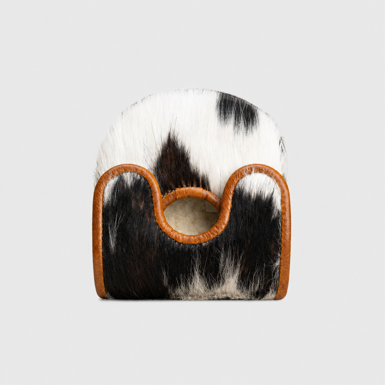 A Center DF3 Putter Cover with a black and white cowhide body and tan leather trim, featuring a circular cutout handle, shown against a light gray background.