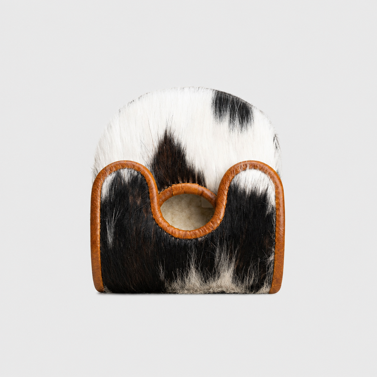 A Center DF3 Putter Cover with a black and white cowhide body and tan leather trim, featuring a circular cutout handle, shown against a light gray background.