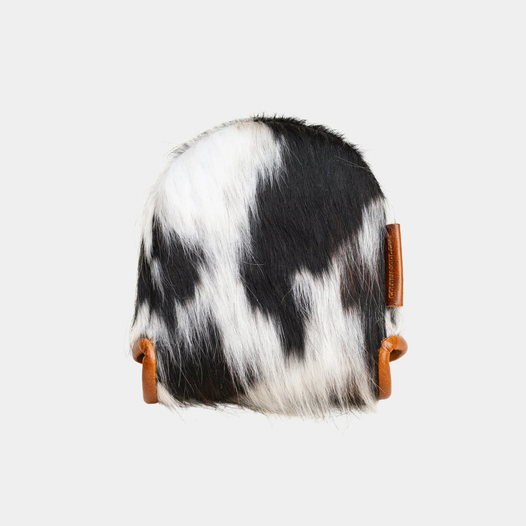 A Center DF3 Putter Cover made of black and white cowhide with brown leather strap accents, shown against a light gray background.