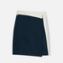 A color-blocked wrap skirt in navy blue and off-white, shown flat against a light gray background.