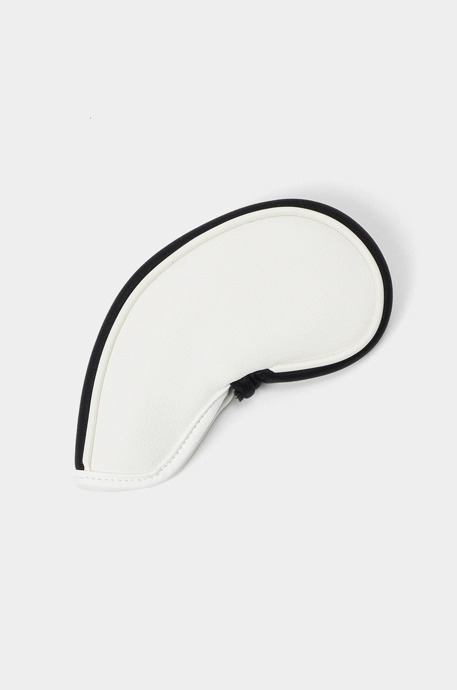 White paddle with black handle on a light gray background