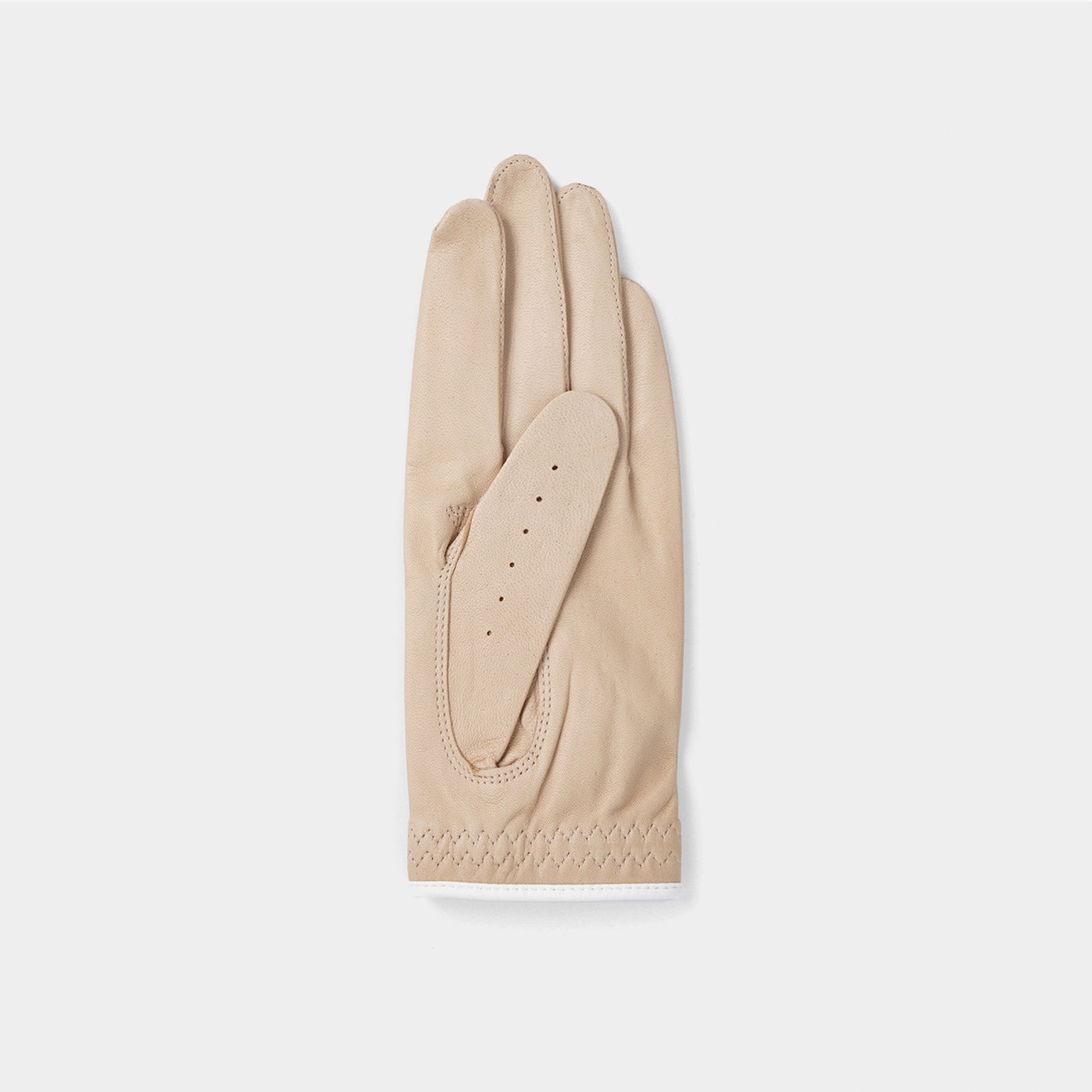 Beige glove on a light gray background