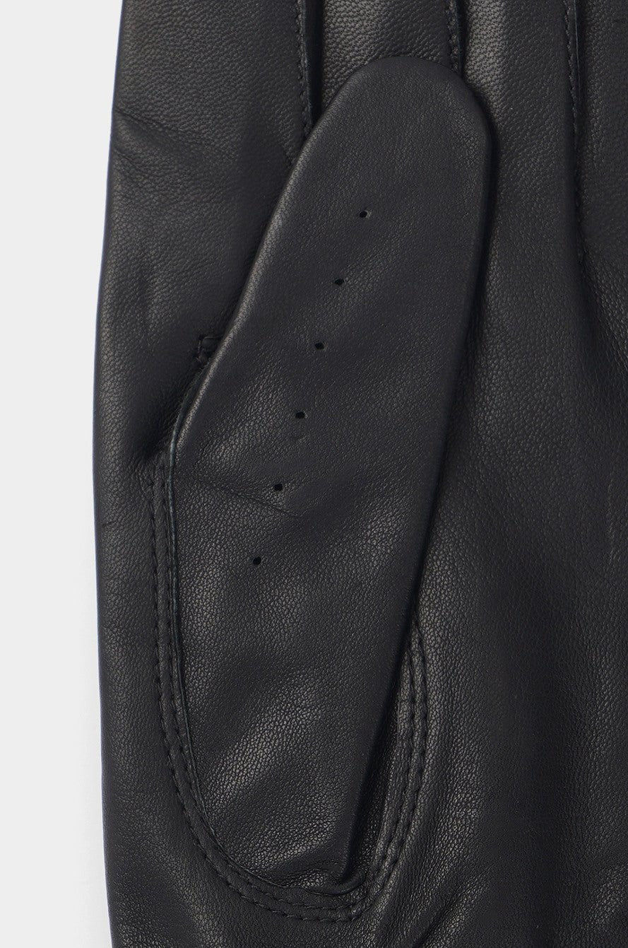 Close-up of a black leather glove on a white background