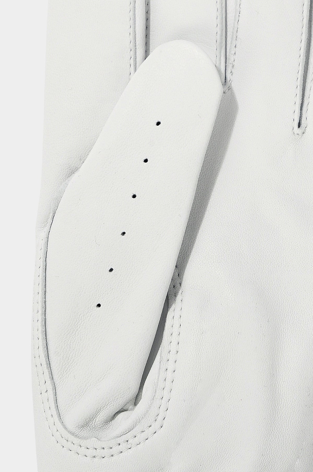 Close-up of a white leather glove with stitching details on a light gray background