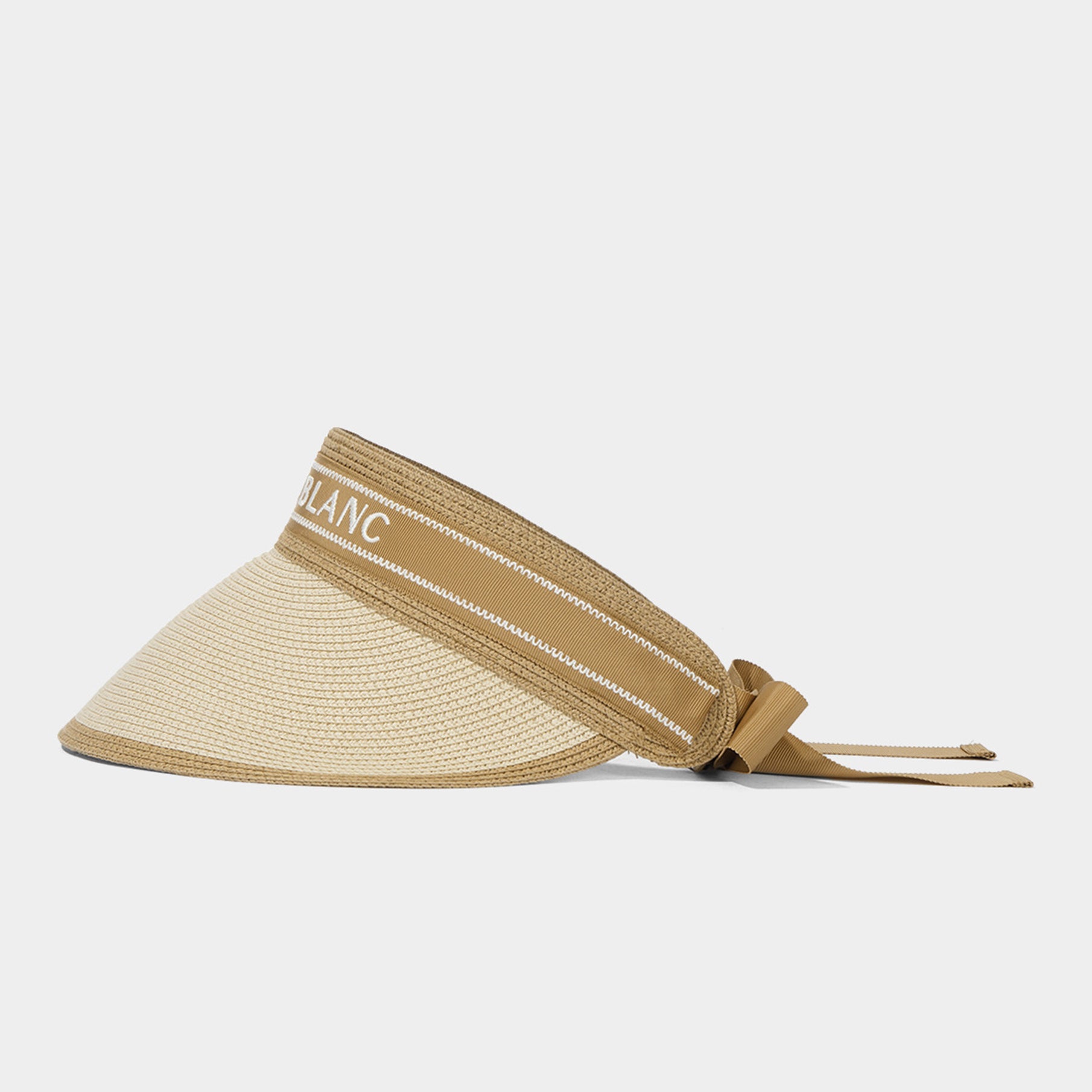 Beige visor with a white band on a light gray background