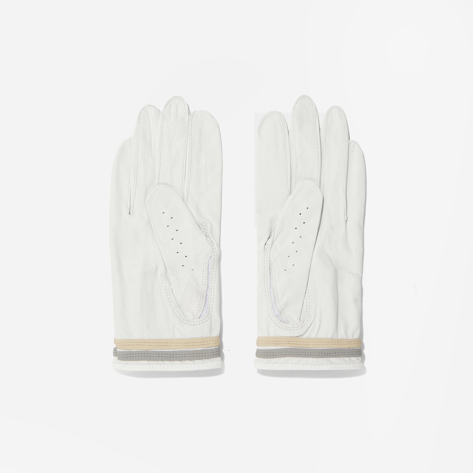 Pair of white leather gloves with beige accents on a light gray background