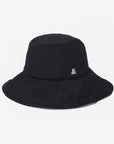 Black bucket hat with a small logo on a light gray background