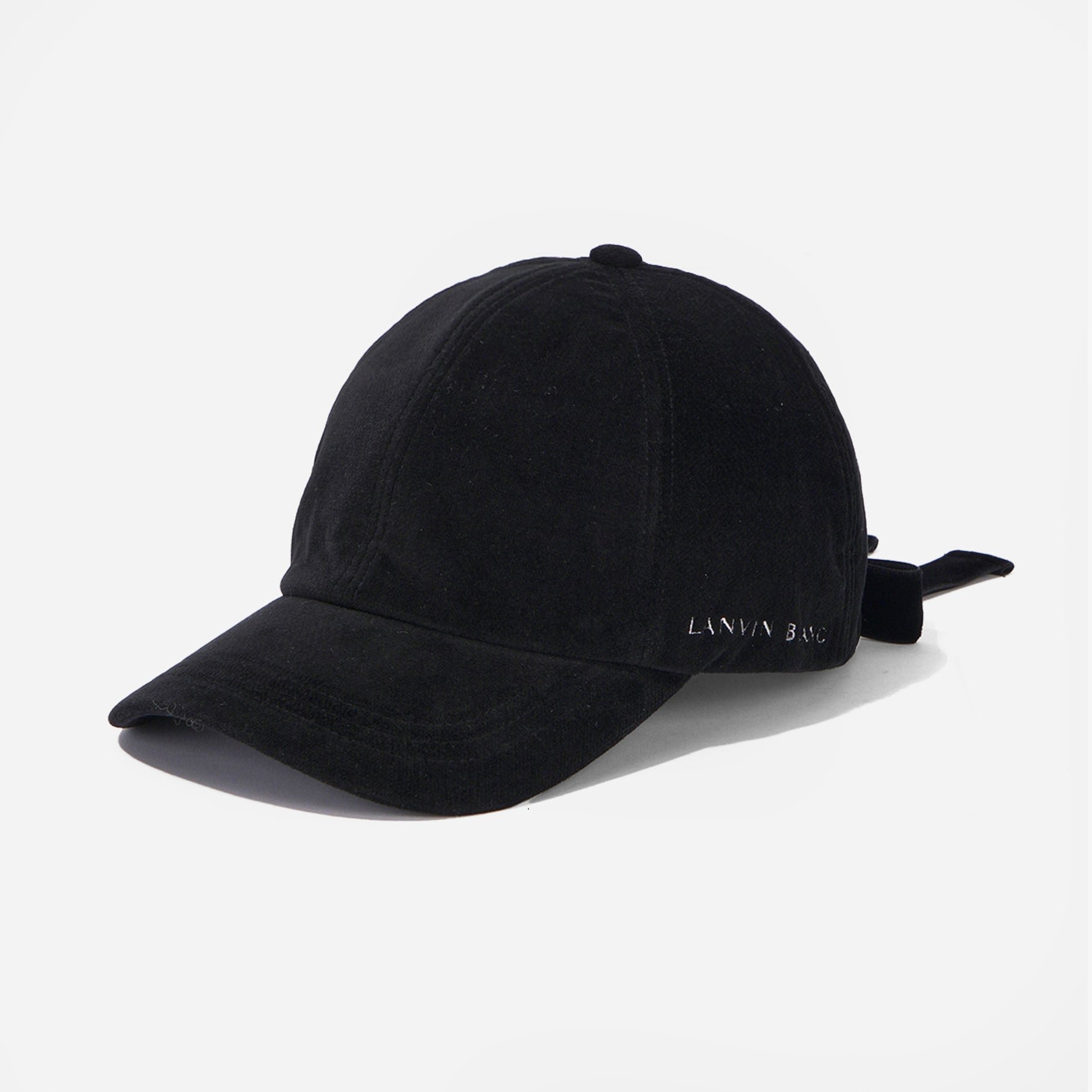 Black cap with a brand logo on a light gray background