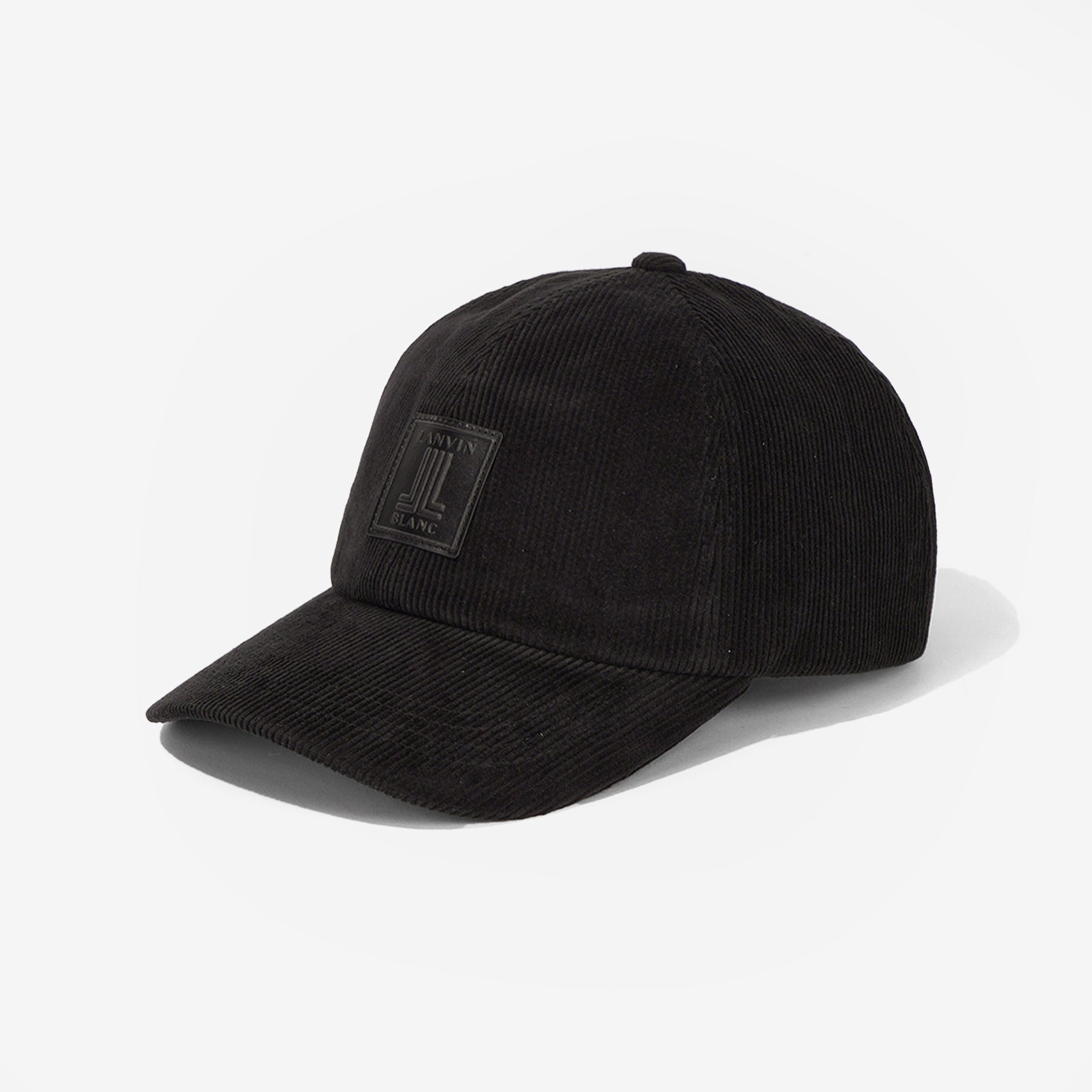 Black corduroy cap with a patch on a white background
