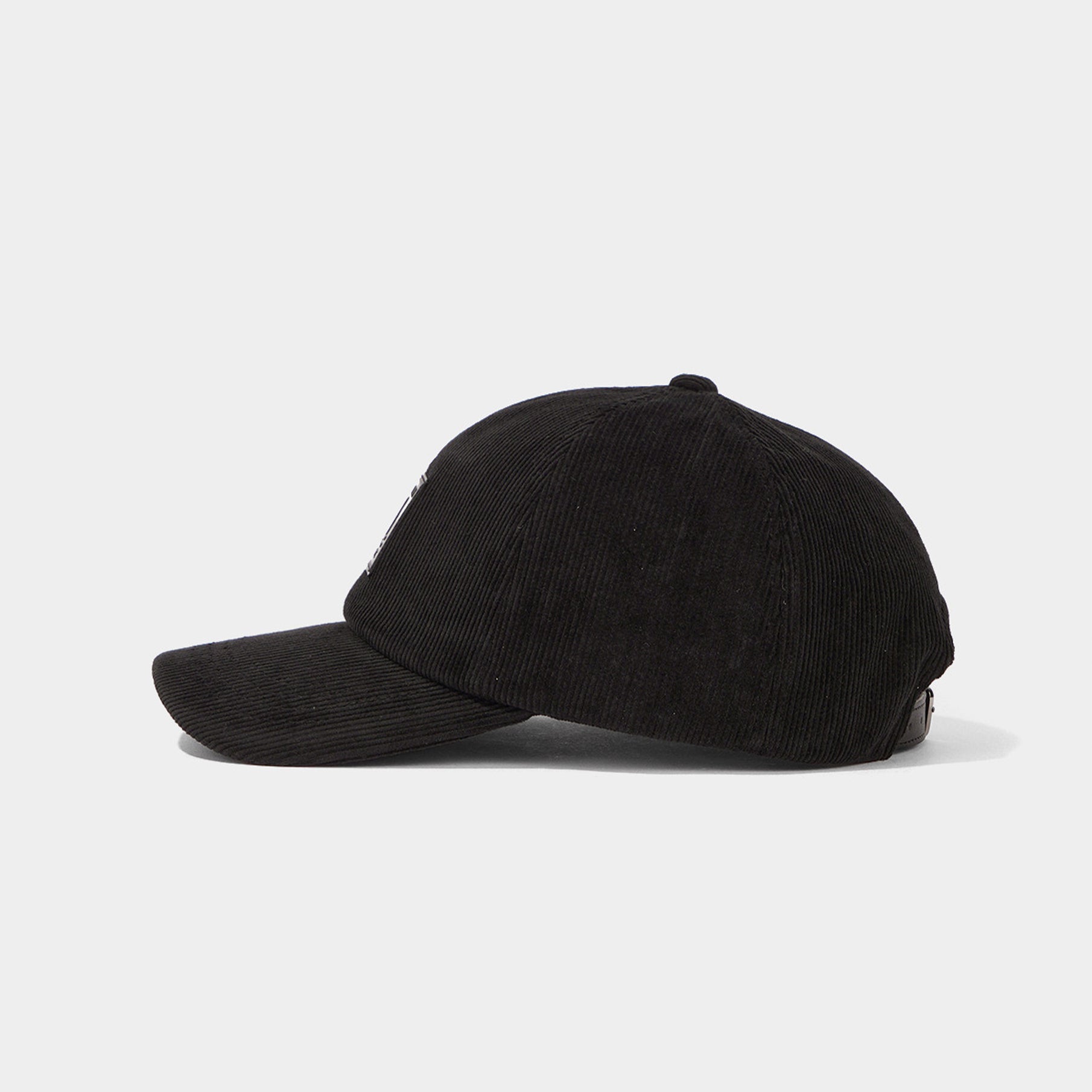 Black corduroy cap on a white background