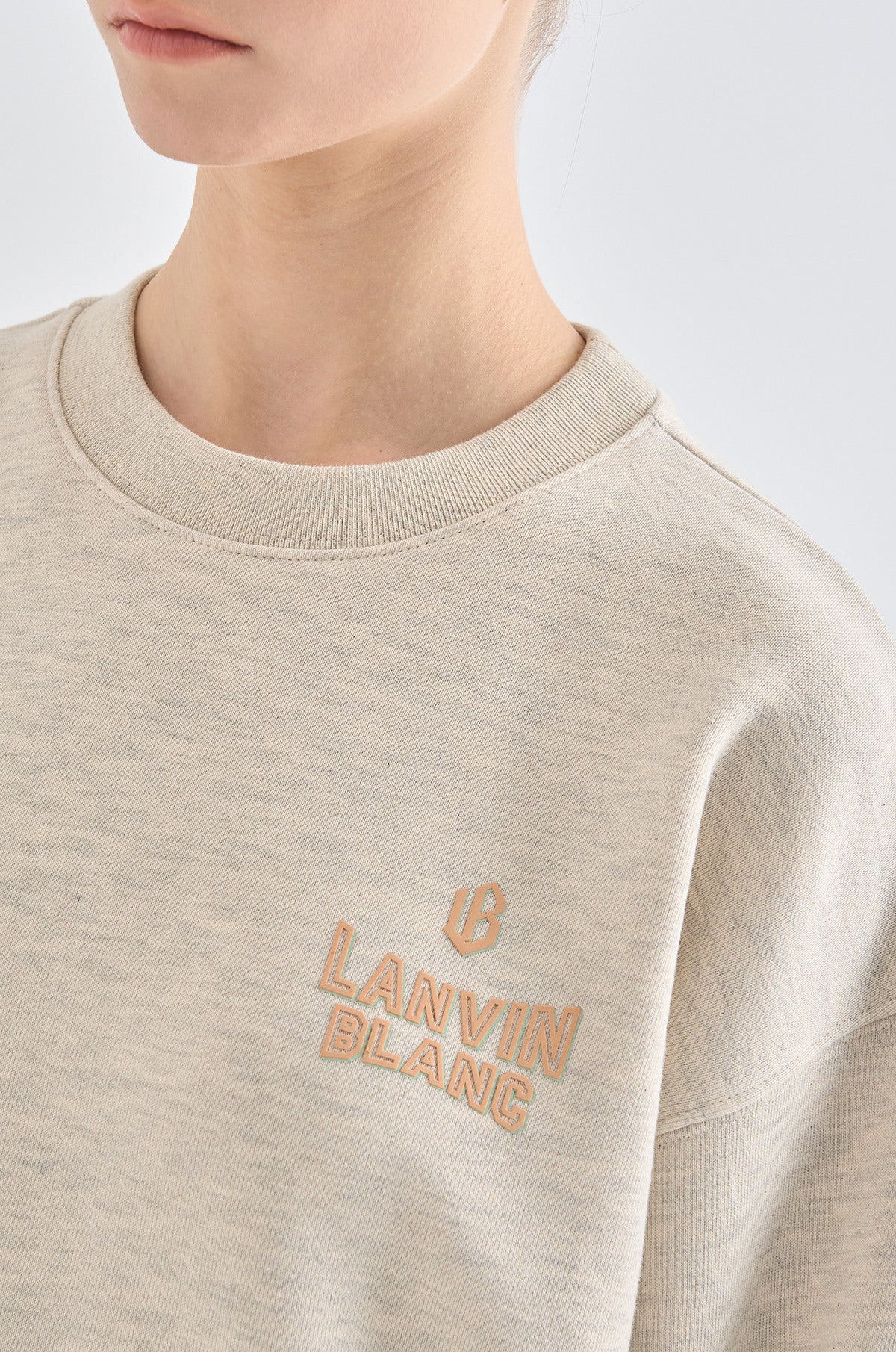Beige sweatshirt with 'LANVIN BLANC' logo on a plain background