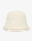 Beige bucket hat with a small decorative element on a white background