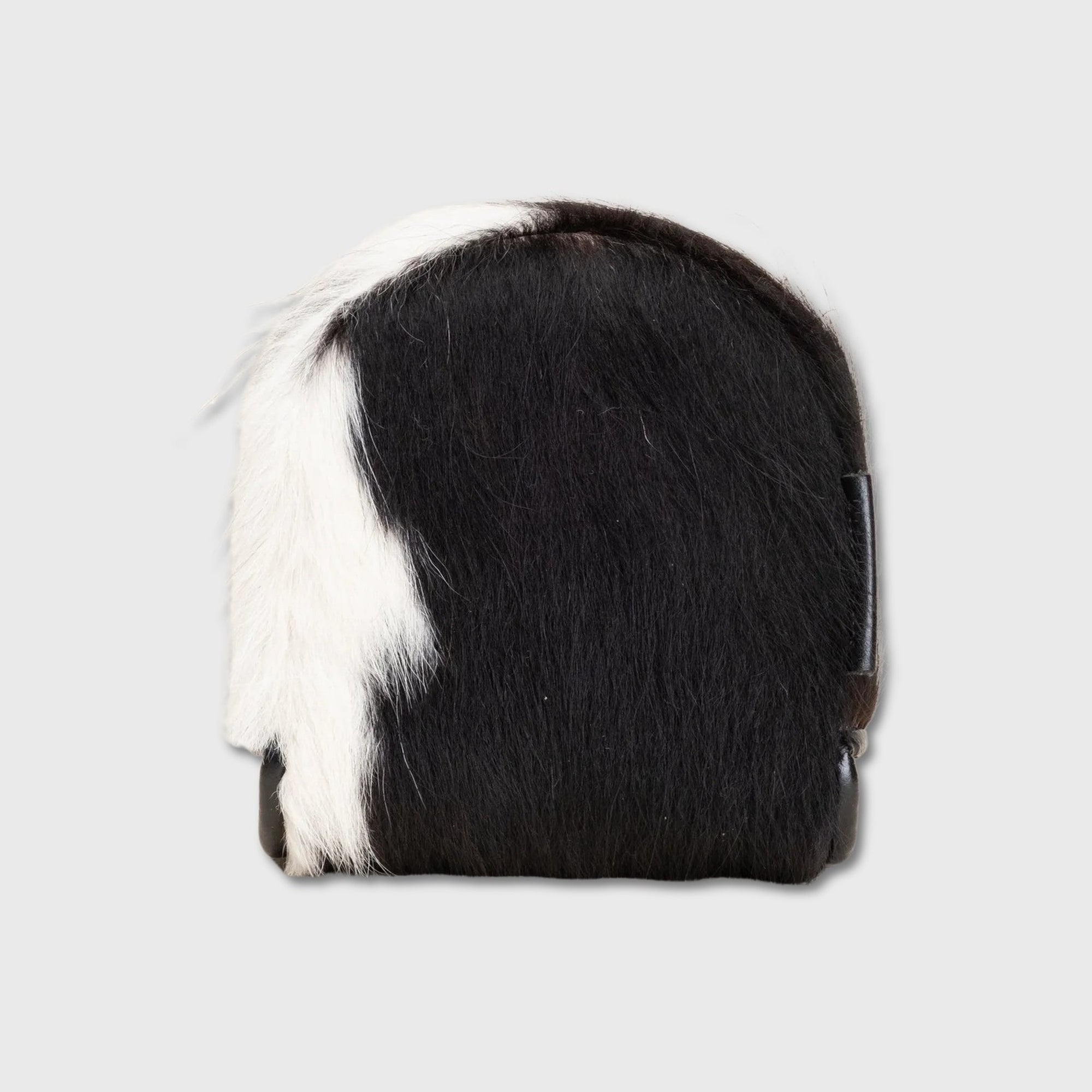 A small black and white cowhide Center DF3 Putter Cover shown from the back on a light gray background.