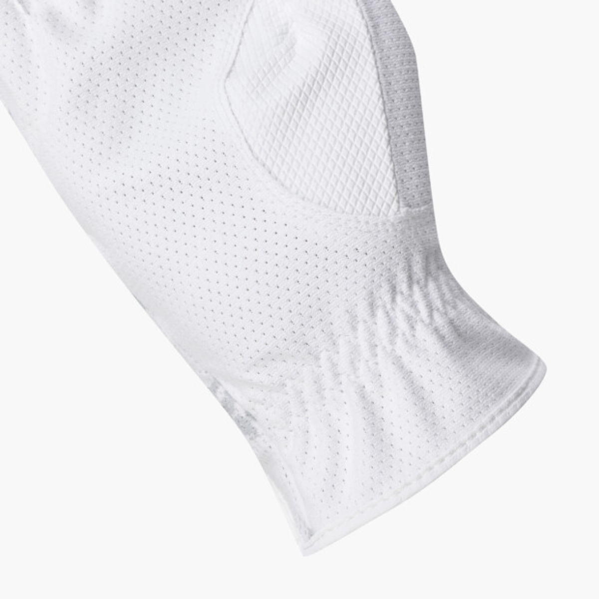 Close-up of a white athletic sleeve or glove with a breathable perforated mesh texture and ribbed cuff, shown on a light gray background.