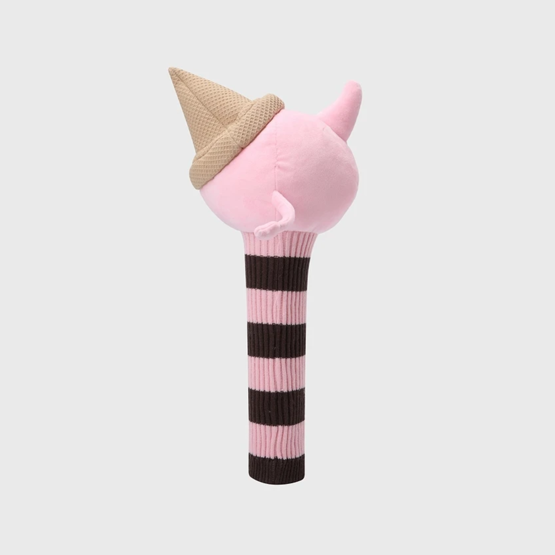 A plush ice cream cone toy with a pink ball top, a beige textured cone, and a striped handle in pink and dark brown, shown against a light gray background.