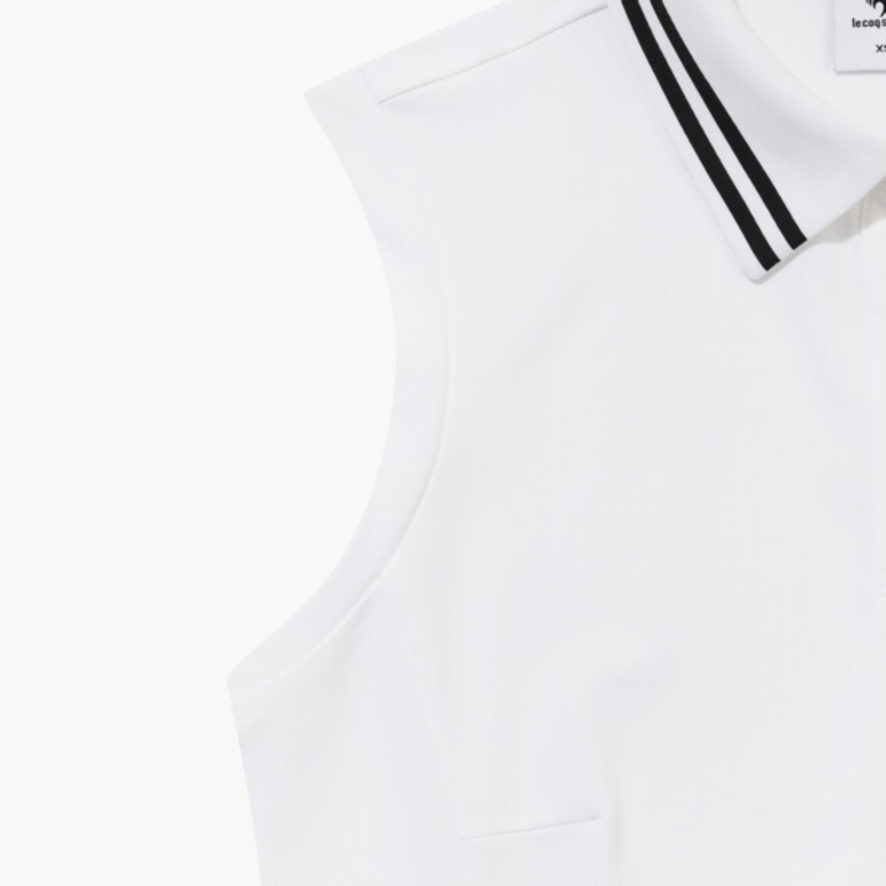 Close-up of a white sleeveless top or vest with a collar featuring two black stripes, shown on a plain white background.