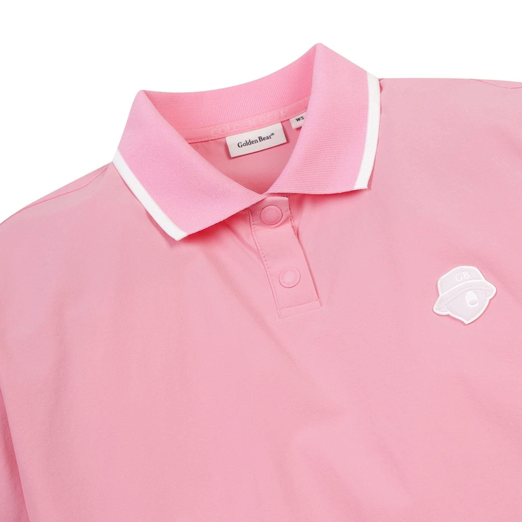 A close-up of a pink polo shirt with a white-trimmed collar, a two-button placket, and a small white embroidered logo on the chest. The brand label inside the collar reads Golden Bear.