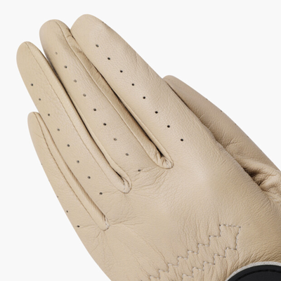 A close-up of a beige leather glove with perforated details on the fingers, shown against a plain light gray background.