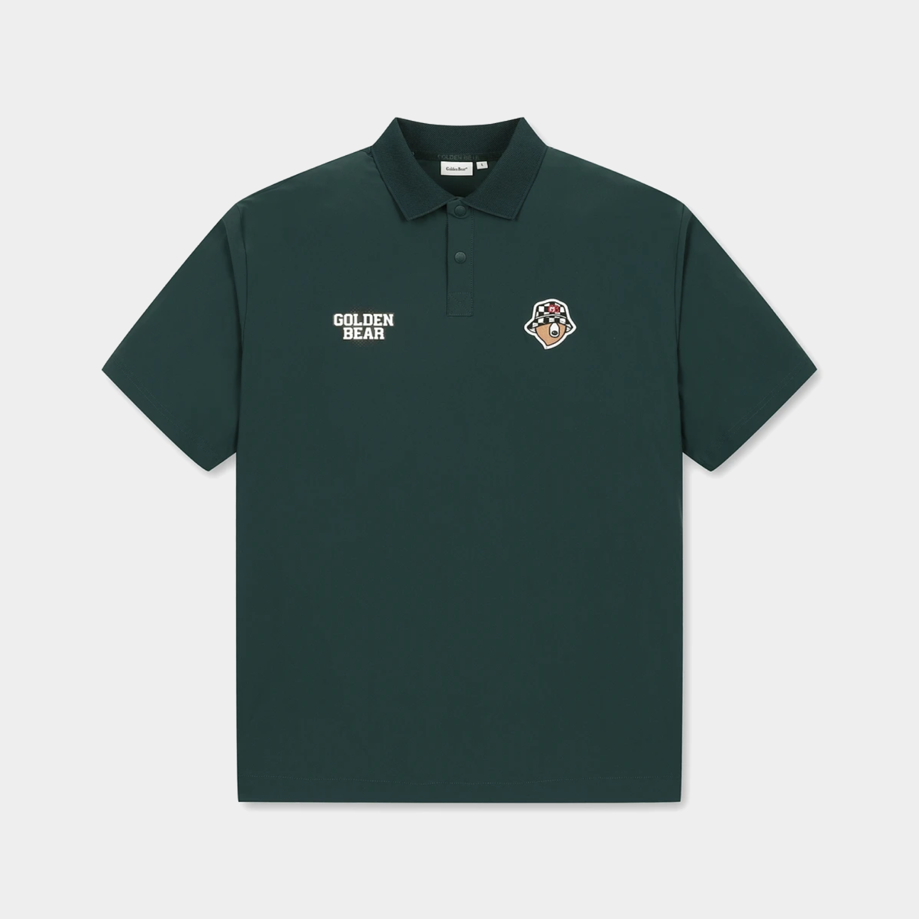 A dark forest green short-sleeve polo shirt with a collar and a three-button placket. It features 'GOLDEN BEAR' printed in white on the left chest and a small multicolor bear head patch on the right chest, displayed against a light gray background.