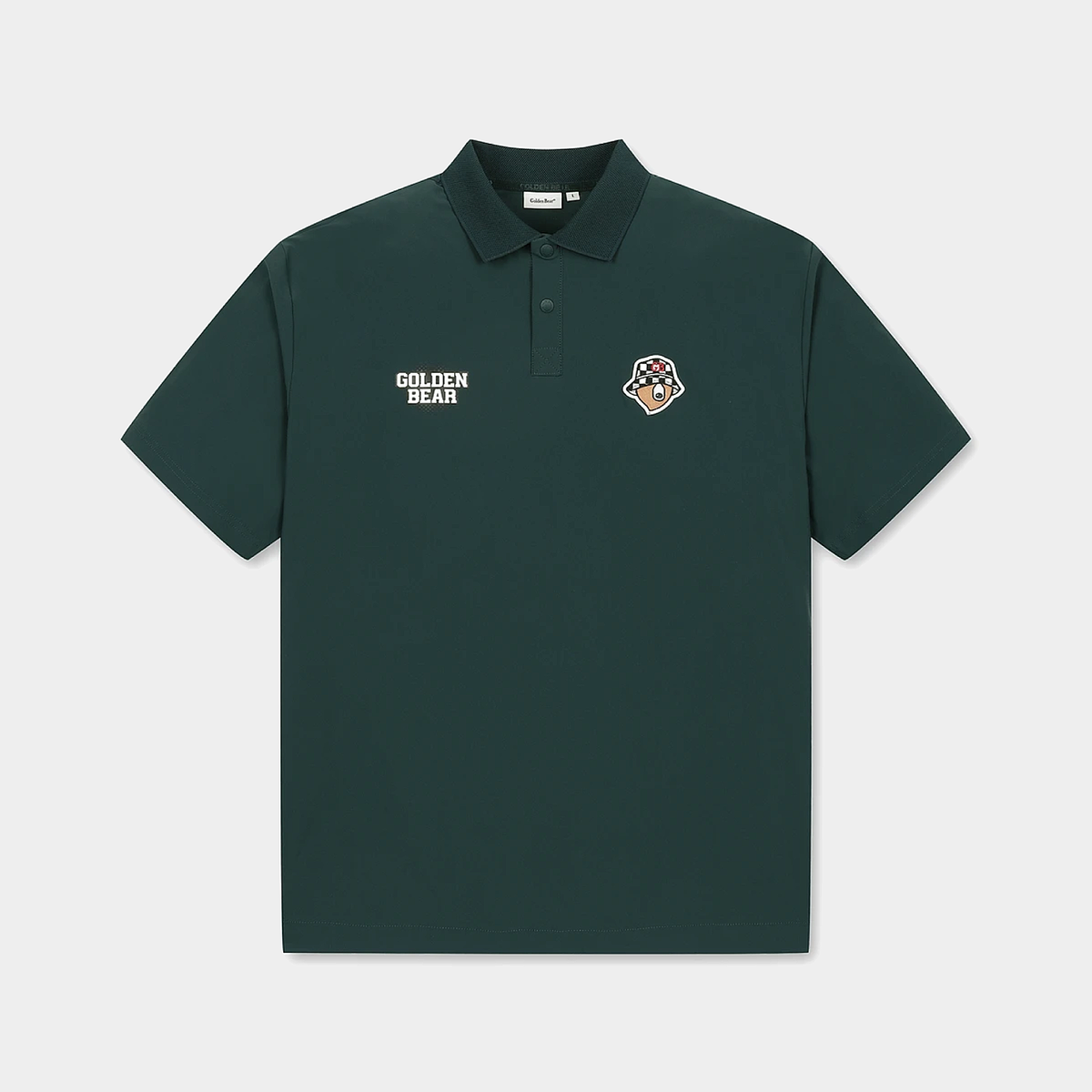 A dark forest green short-sleeve polo shirt with a collar and a two-button placket. It features 'GOLDEN BEAR' printed in white on the left chest and a small multicolor bear head patch on the right chest, displayed against a light gray background.