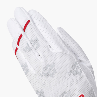 A close-up of a white perforated glove with red accent stripes on the fingers and a subtle gray camouflage pattern on the back, set against a plain light gray background.